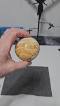 Load and play video in Gallery viewer, Orange Calcite Sphere
